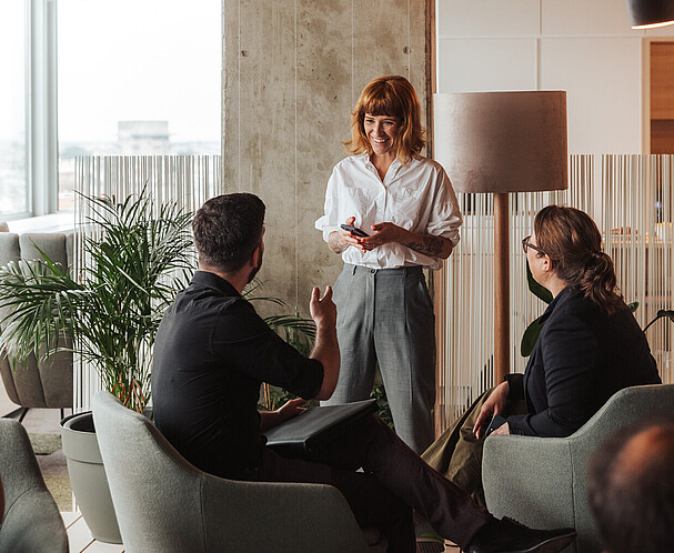 Group of people talking in an office