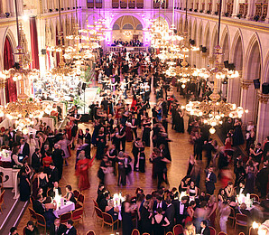 Couples dancing in a large ballroom