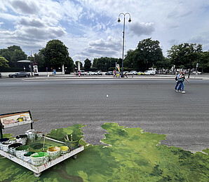 Urban space with painted backdrop in the foreground