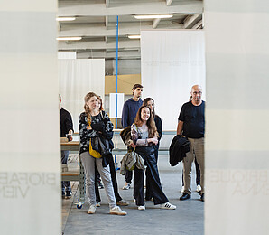 several visitors in an exhibition space of Biofabrique Vienna