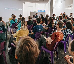 Woman gives talk in front of audience