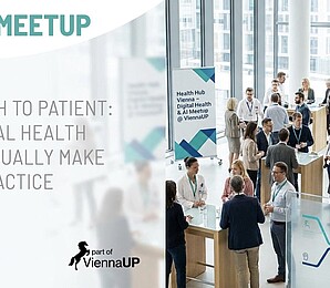 Several people are standing facing each other and chatting during an event