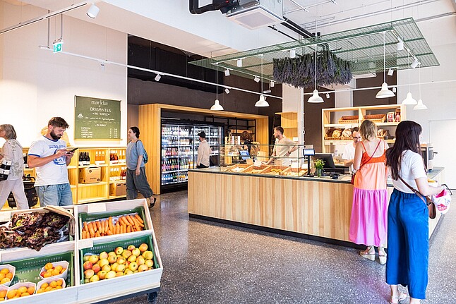 Fruit stands and a counter inside the markta store in Vienna's 9th district