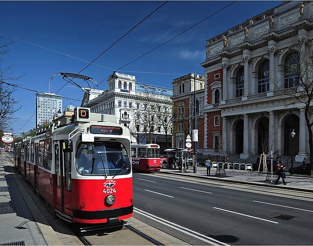 An old, red Viennese tram on the Vienna Ringstraße