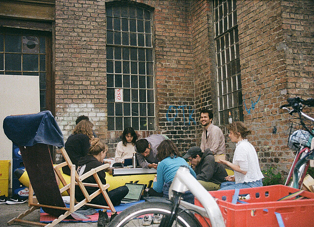 A group of young people hanging out in a courtyard