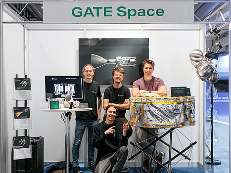 The GATE Space team at a fair with their products